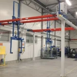 Suwnice natorowe specjalne na estakadzie ze sztywnym prowadzeniem ładunku i napędami sterowanymi falownikami